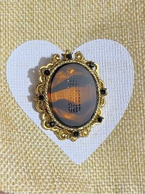 Gold-Tone Amber Oval Brooch with Black Accents